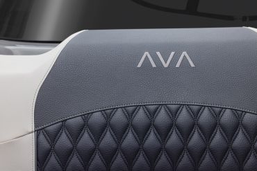 Close-up of AVA logo stitched on textured leather.