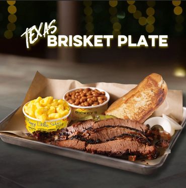 Texas Barbecue Brisket Plate with mac and cheese, baked beans, Texas Toast bread, and onions.