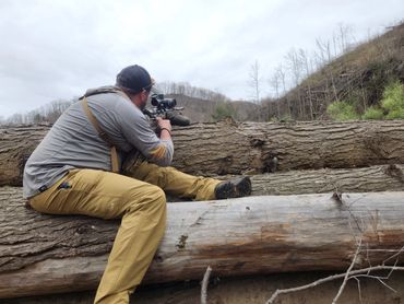 Shooting off a tree at a target 1000 yards away at upwards angle.