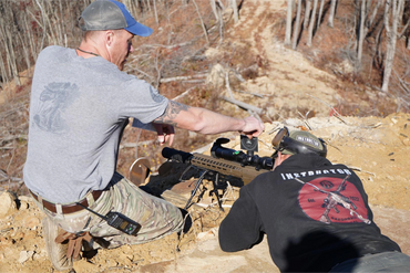 Instructors demonstrate how to compute ballistic solutions for high angle engagements.