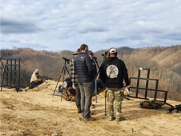 Students and instructors talk about the effects of wind during the Mountain Rifleman Course.