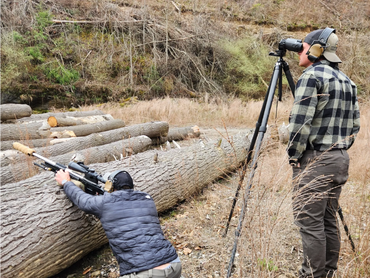 Instructors demonstrate how to shoot from alternate positions at the mountain rifleman course.