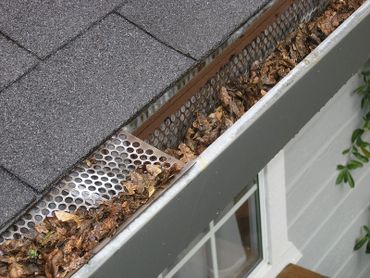 An example of failed gutter guards in Richmond, Va. They were removed and then the gutters cleaned.