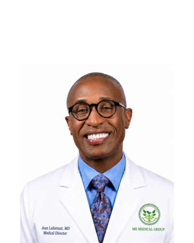 Portrait of a smiling male doctor in white coat and glasses.