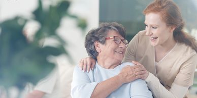 Caring nurse helping an elderly woman With talking
