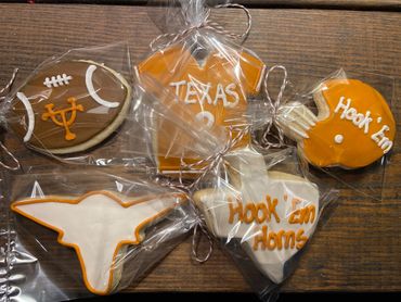 Texas Longhorns-themed decorated cookies in clear bags.