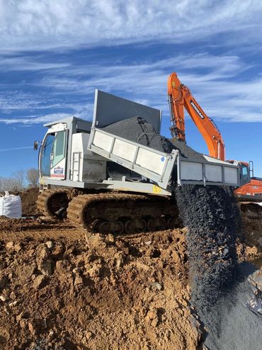 Excavator Placing stone fill
