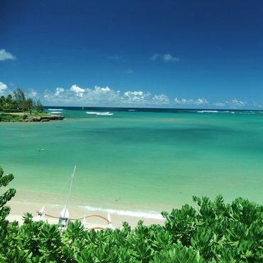 Hawaii vacation rental in Kawela Bay featuring luxurious beachfront accommodations and scenic views of the North Shore, ideal for family and group getaways.