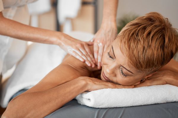 Spa, Wellness and Black Woman Getting Luxury Back Massage for Health