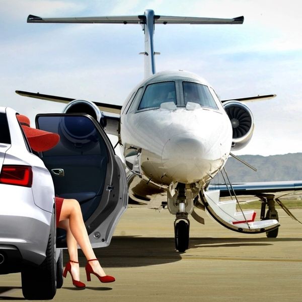 Women getting ready to boarding private jet at airfield
