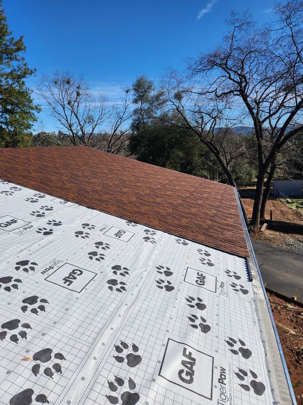 Natural Rust ASC Nu-Wave Corrugated metal roof over Tiger Paw underlayment in Oakdale, CA.