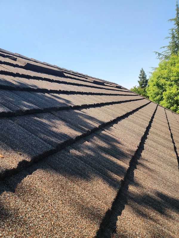 Timberwood Unified Steel stone coated metal roofing with integrated EZ Vent installation in Ripon,CA