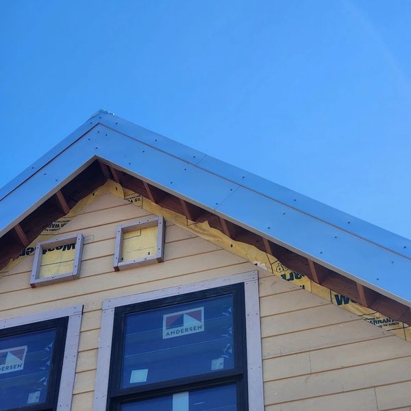 Premium Zincalume Plus corrugated roof. We custom-fabricate exact-fit metal covers for fascia boards