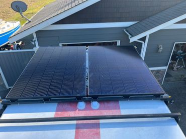 Slide out solar panels in stowed position