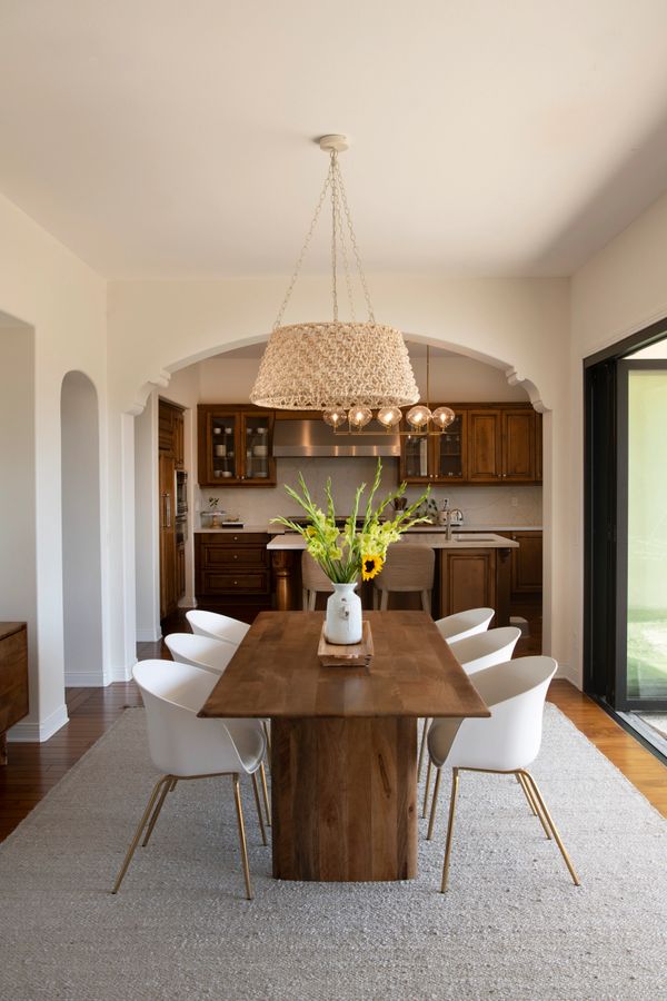 Image of dining table and kitchen in Southern California Residence