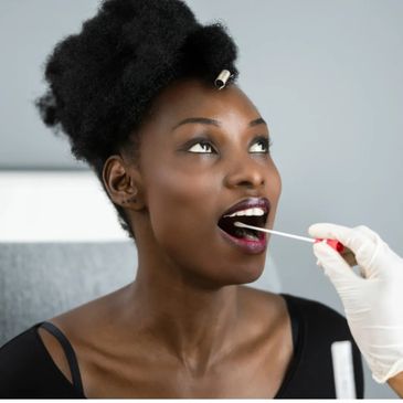 Woman undergoing a COVID-19 test with a swab in her mouth.