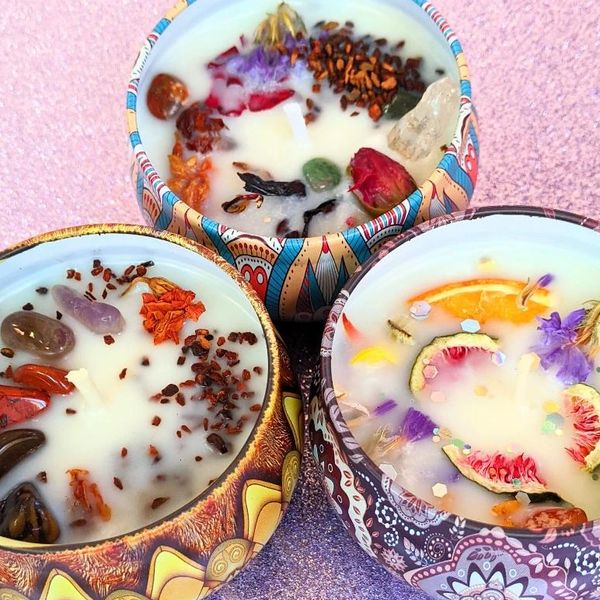 Artistic wax bowls with embedded objects like candles and money