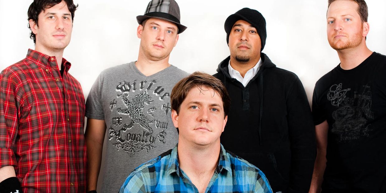 Redline Addiction members at photoshoot on white background rocking Under Armor gear
