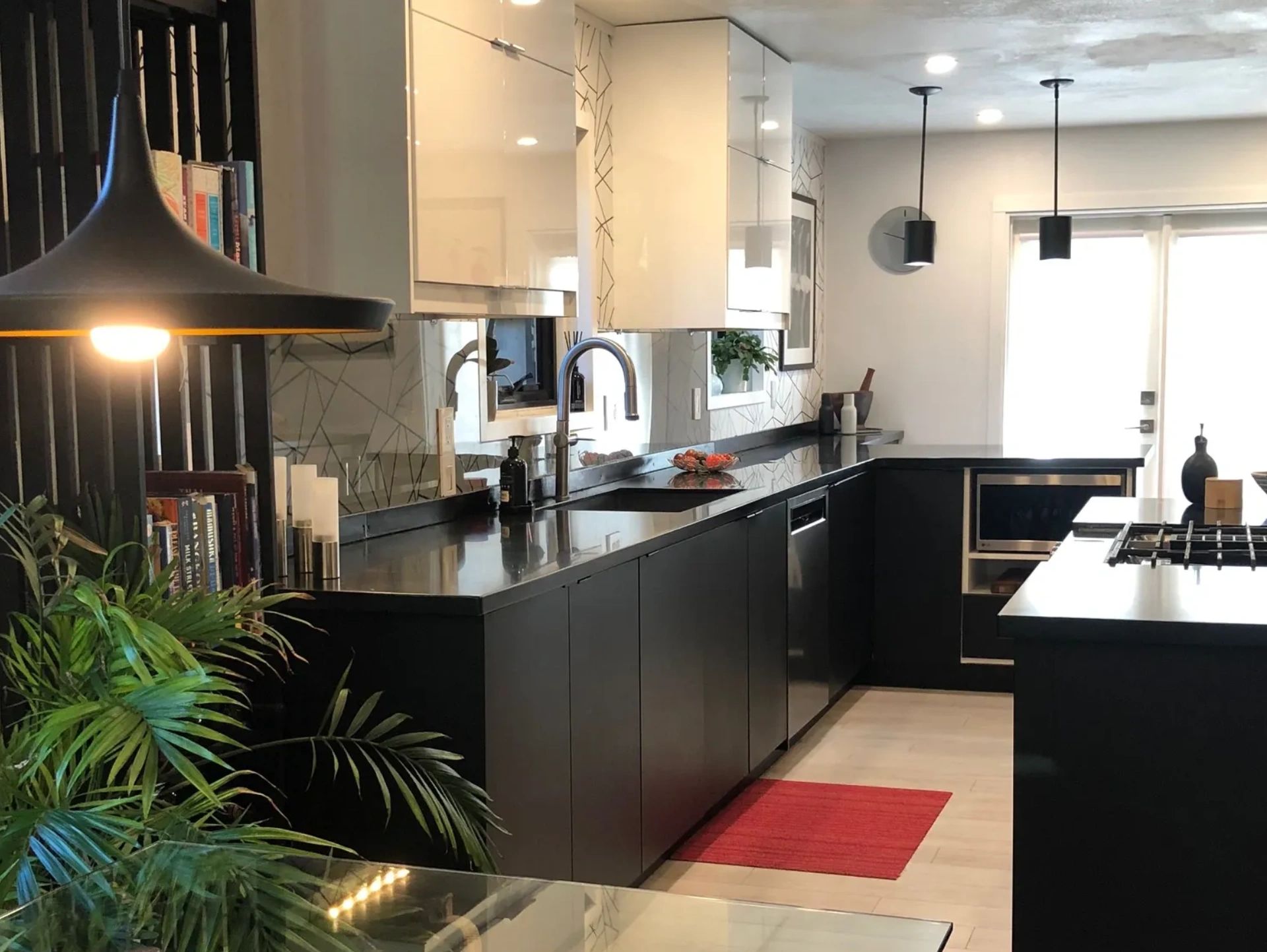 Black and white kitchen with stainless steel appliances