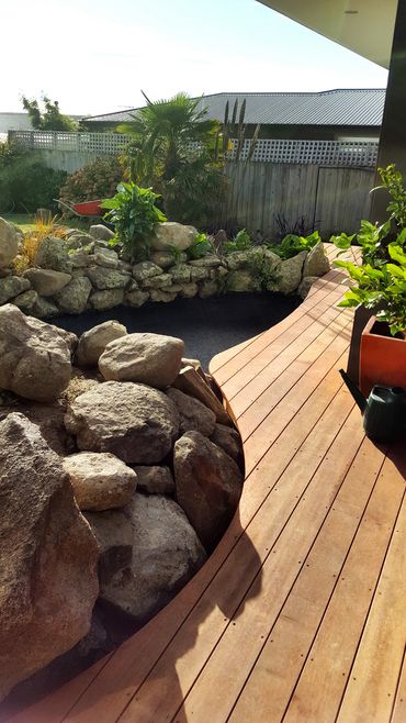 Curved decking kwila decking around fishpond