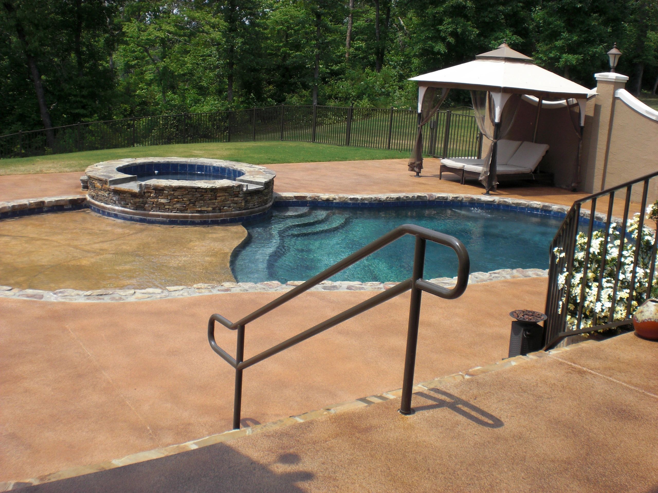Pool Deck with distressed decorative concrete finish.