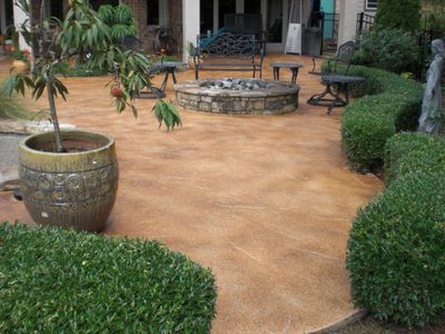 Pool deck with concrete stain in a distressed finish
