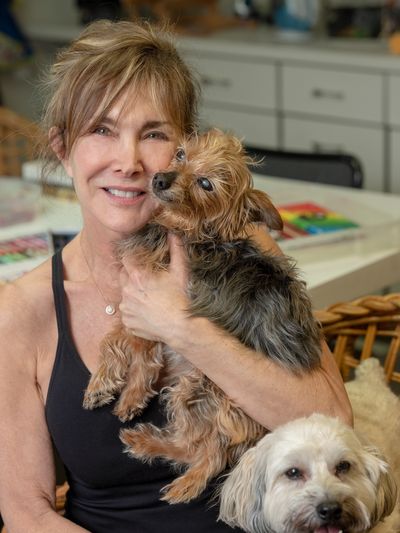 Claudia Chappel with her dogs.
 " My dogs saved me. They sensed my pain and never left my side"