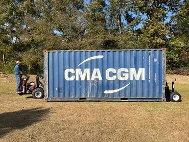 shipping container being moved