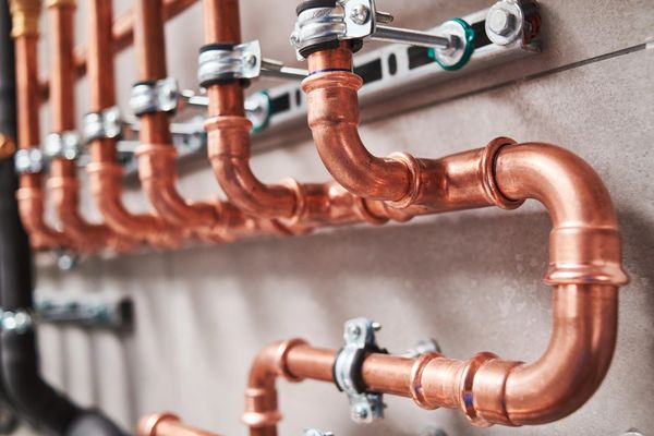 professional layout of copper piping for a commercial plumbing job.