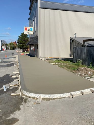 A business sidewalk made of concrete.