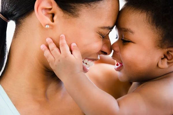 Mother and baby sharing a joyful moment.