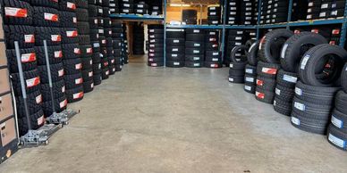 warehouse of tires , hallways with many tires for sale