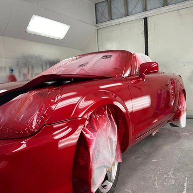 Custom Glossy Red Paint Job on Toyota MR2, Featuring a Sleek and Modern Finish.