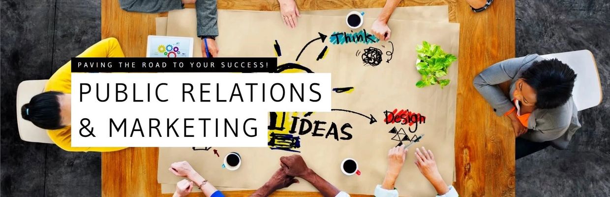 A diverse team brainstorming public relations and marketing ideas around a table.