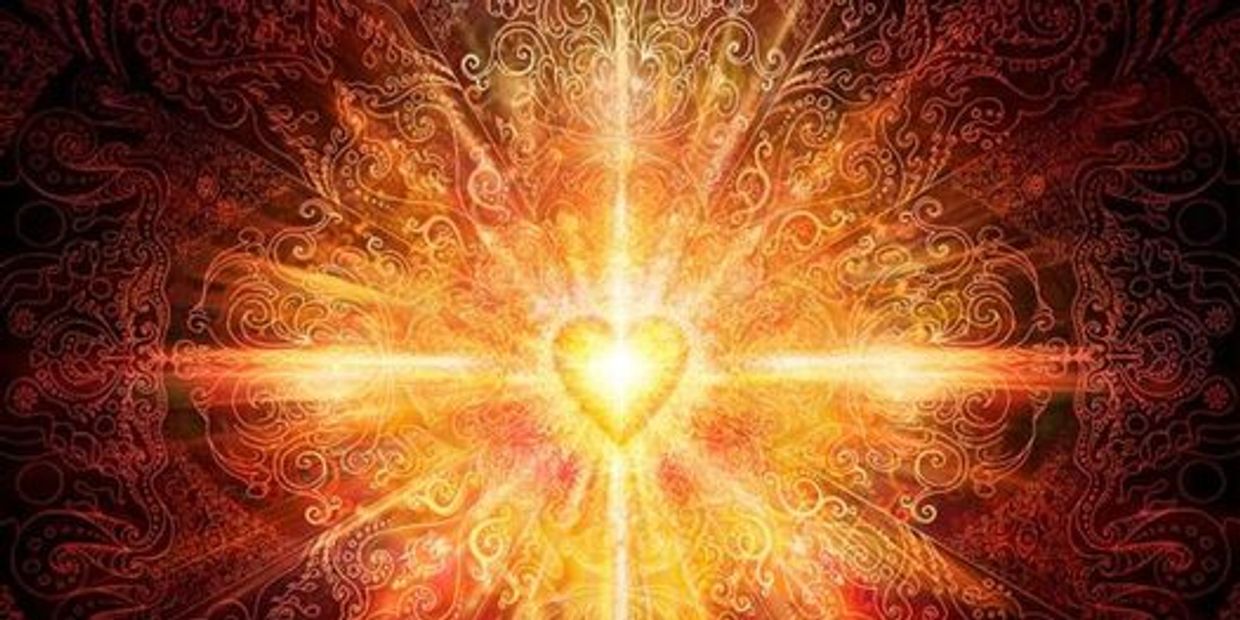 Radiant heart glowing with intricate golden patterns and light bursts.