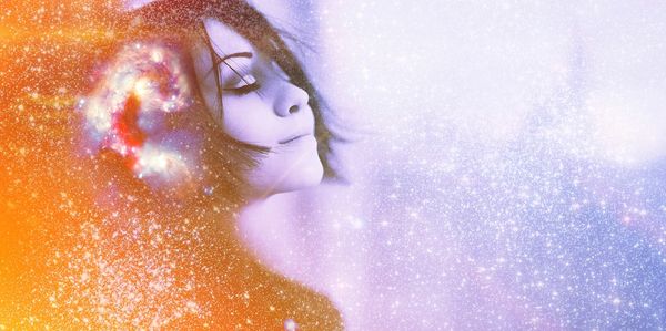 A woman in a meditative state with a swirling universe image.