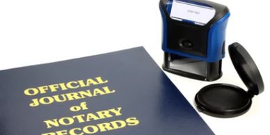 Official journal of notary records with stamp and ink pad.