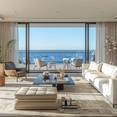 Modern living room with ocean view and minimalist furniture.