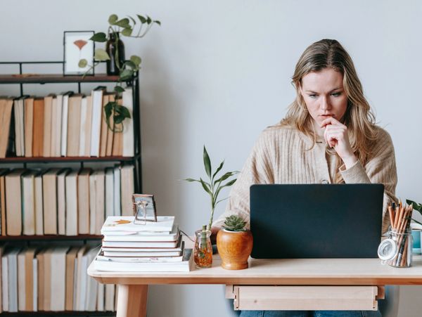 Woman Working At Desk - Compliance Consultant