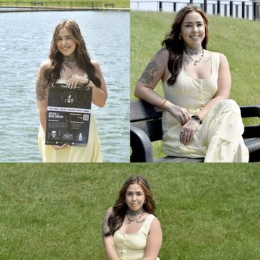 Young woman in yellow dress poses outdoors by water and on grass.