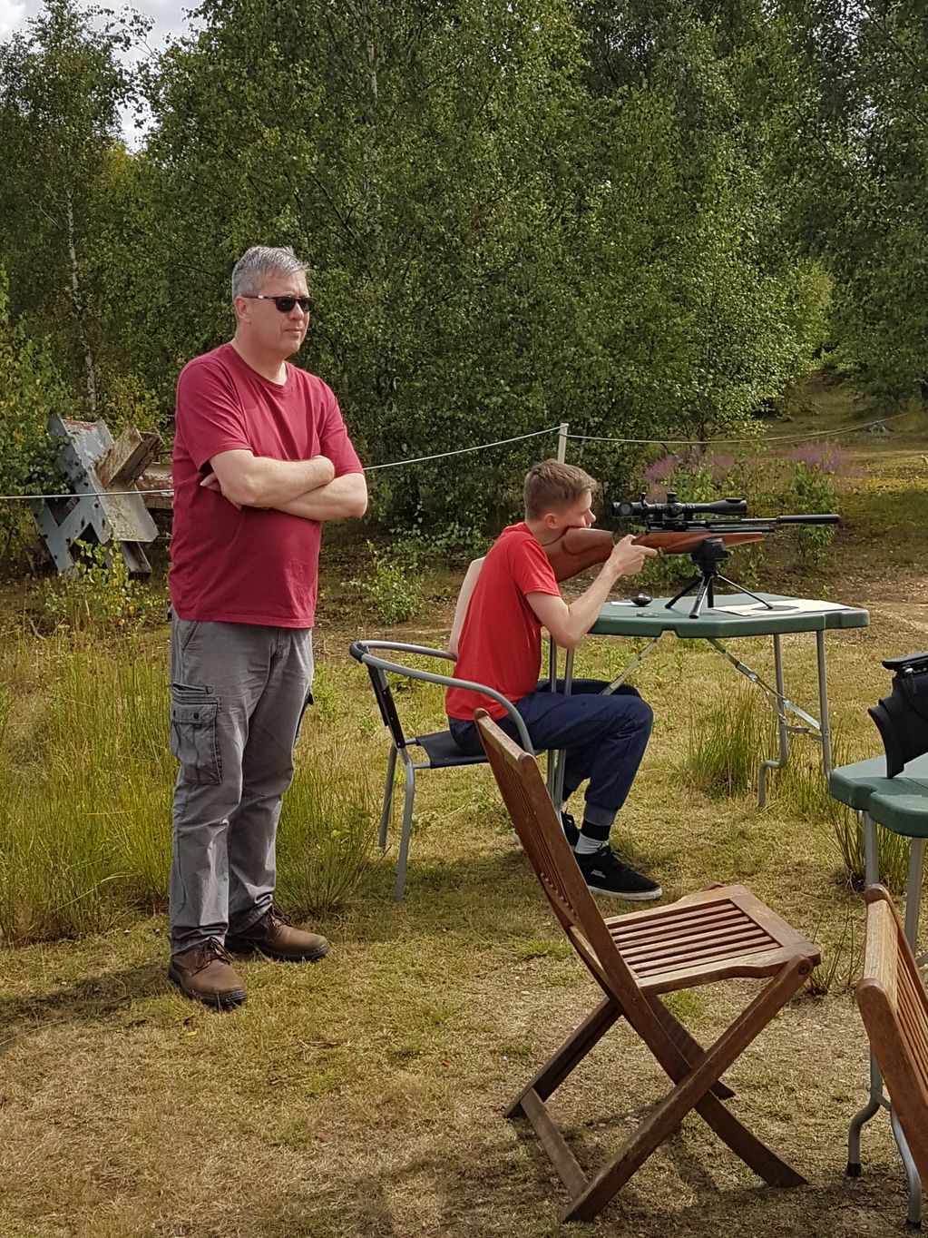 Club Chairperson, Sean McLaughlin, being shown how to do it the right way by his son, Eoin.