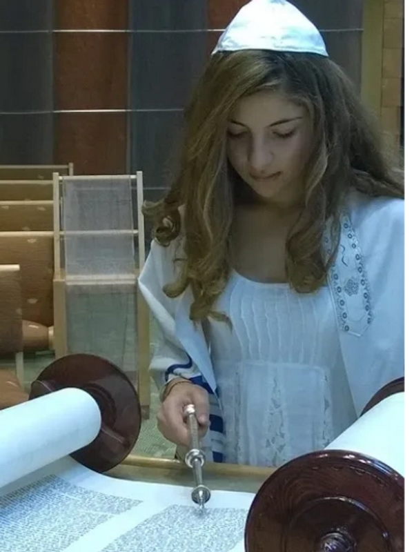 a girl reading the paper