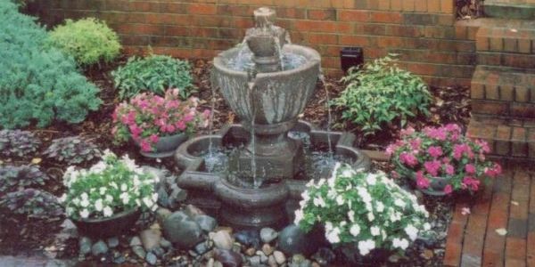 landscape design, paver installation, fountain, lawn care, lawn care near me, retaining wall, flowers