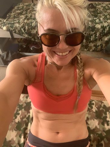 A woman is posing for a selfie