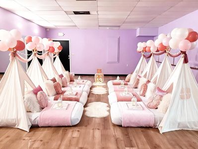 Blush pink and rose gold teepee tent sleepover birthday party setup by Dreamee Slumber Parties.