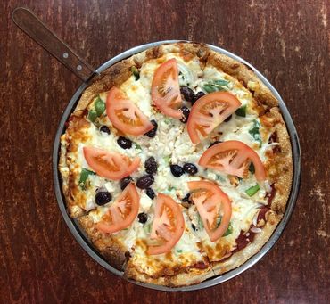 Our pizza dough is made fresh in-house, and we offer a wide variety of crust options, including a gl