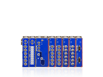 A blue modular electronic circuit board with multiple connectors and ports.