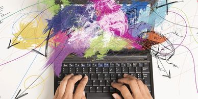 multi-tasking business woman at a laptop