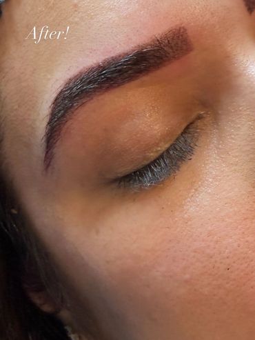 Close-up of a freshly microbladed eyebrow with 'After!' text.