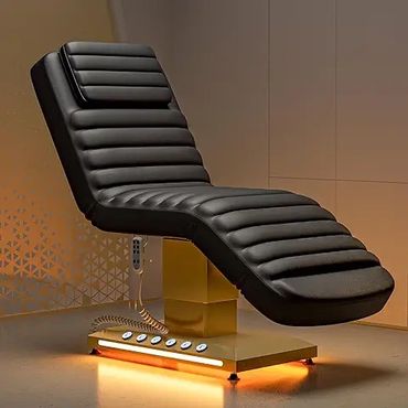 Modern black reclining chair with a golden base and ambient lighting.